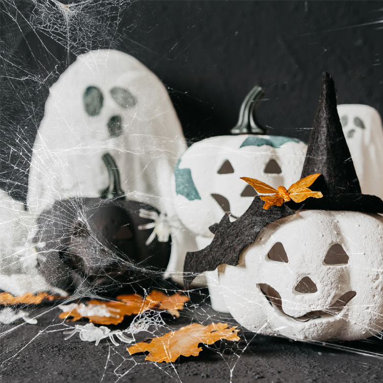 Ghosts and pumpkins with spider webs
